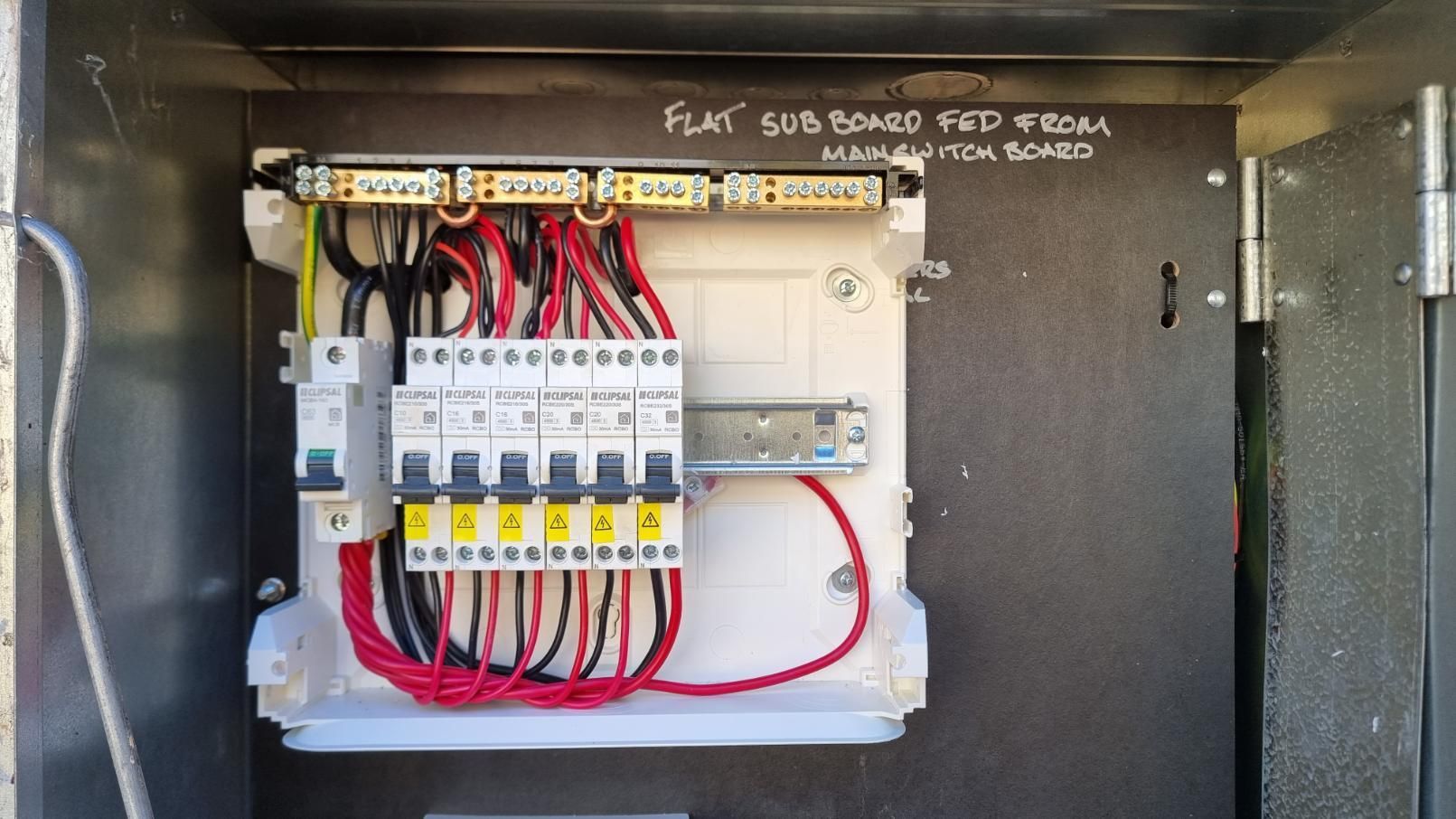 A Close Up Of A Electrical Box With A Bunch Of Wires Coming Out Of It — Licence To Spark In Bateau Bay, NSW
