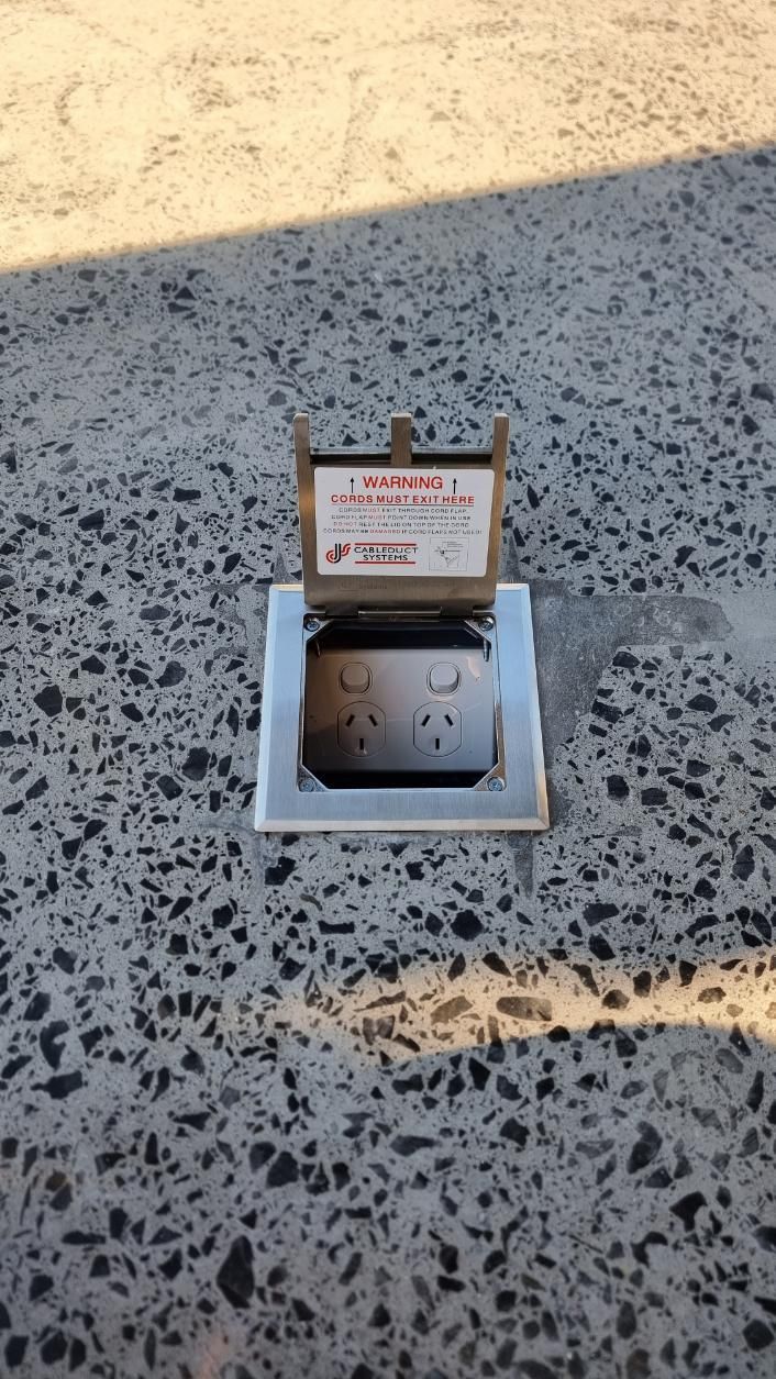 A Electrical Outlet Is Sitting On A Concrete Surface — Licence To Spark In Tuggerah, NSW