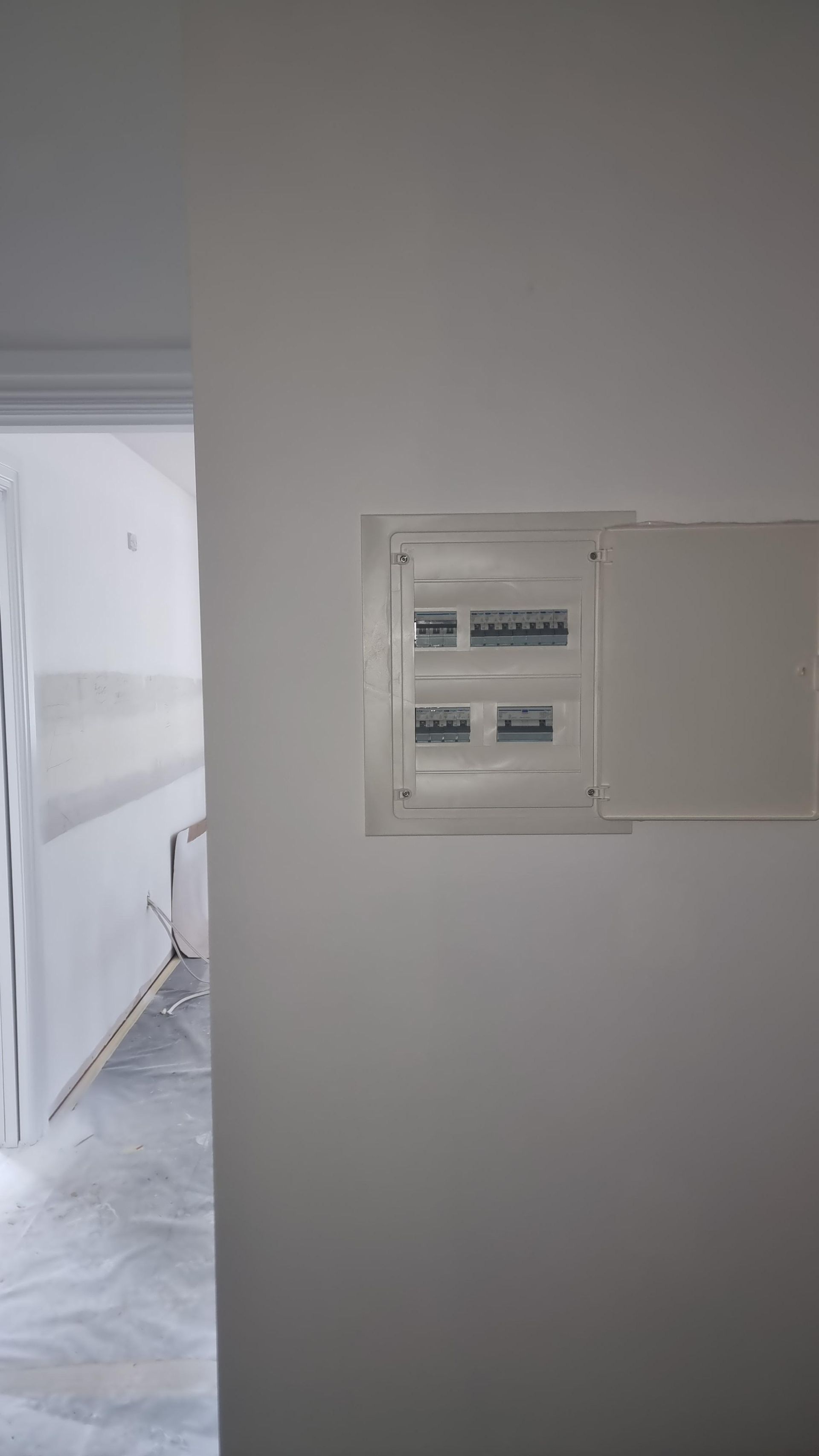 A White Wall With A Electrical Box On It — Licence To Spark In Bateau Bay, NSW