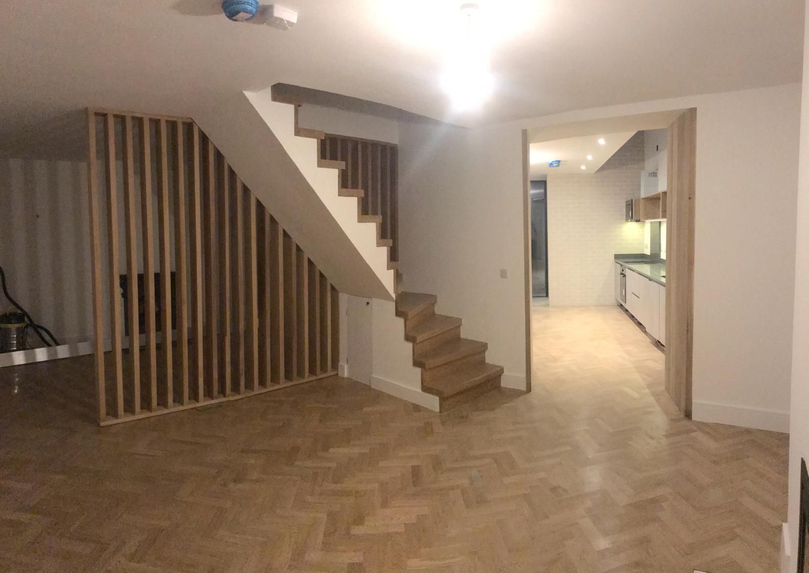 there is a staircase in the middle of the room .