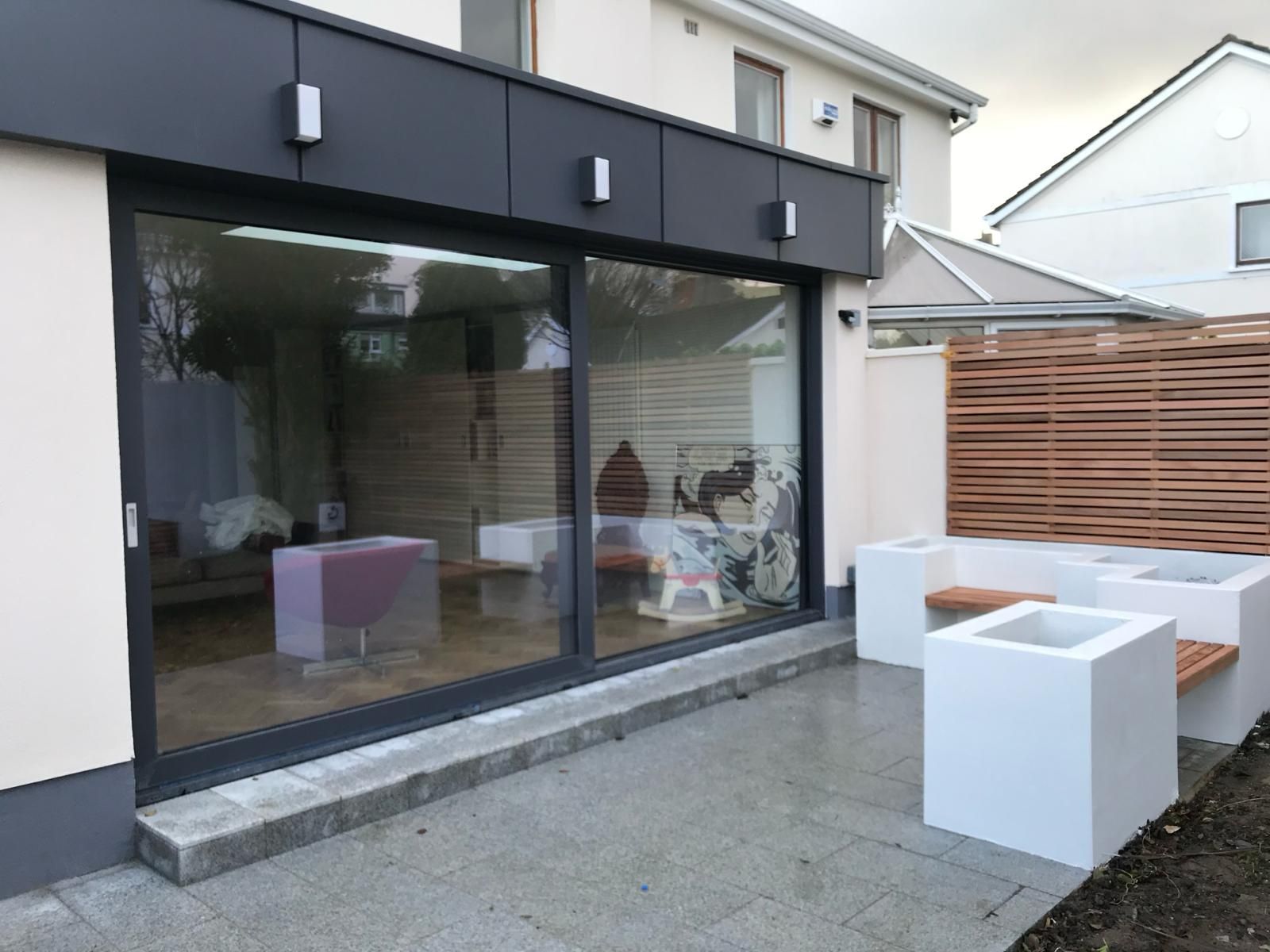 a house with a patio and sliding glass doors
