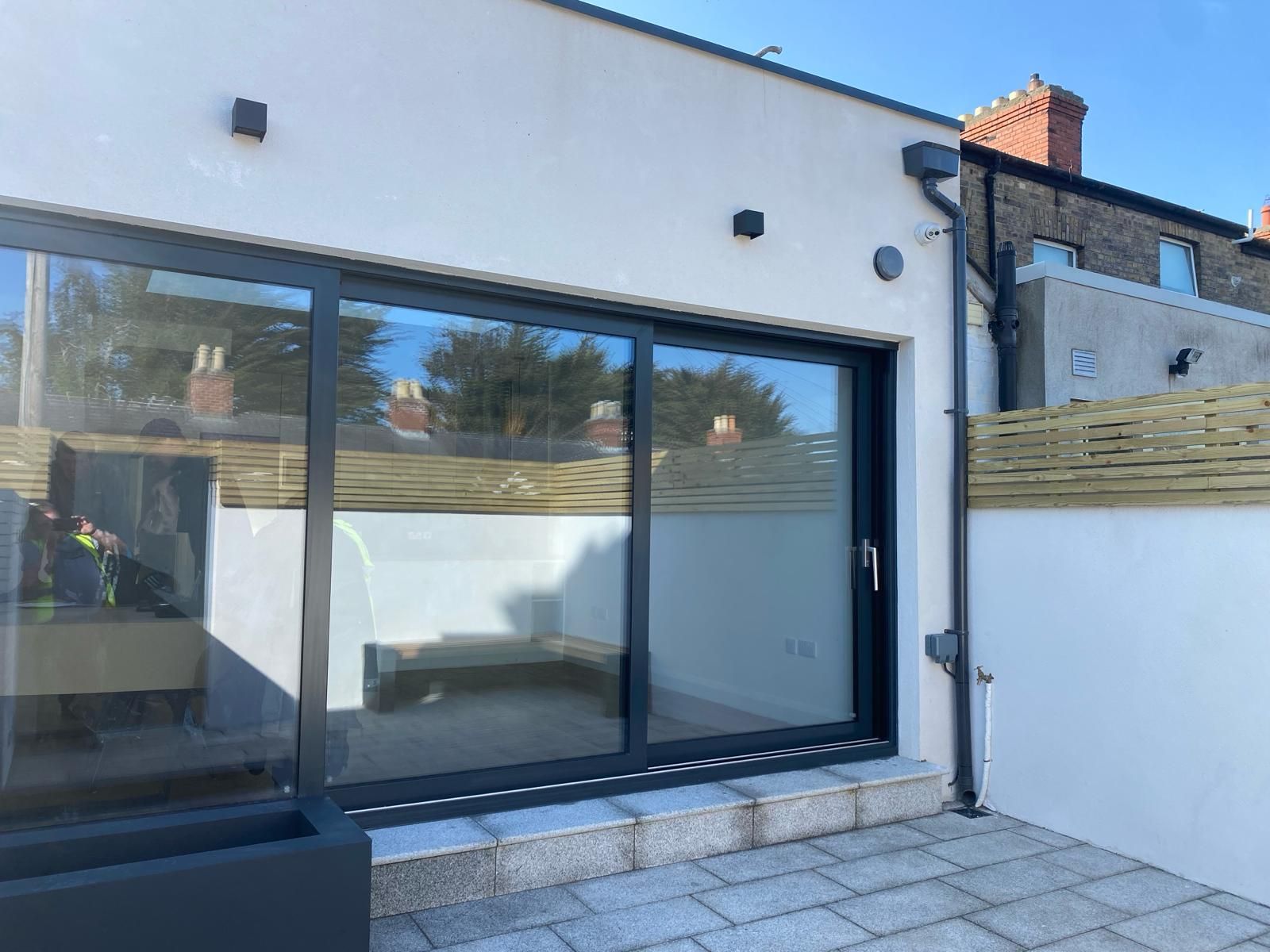 a house with a patio and a sliding glass door .