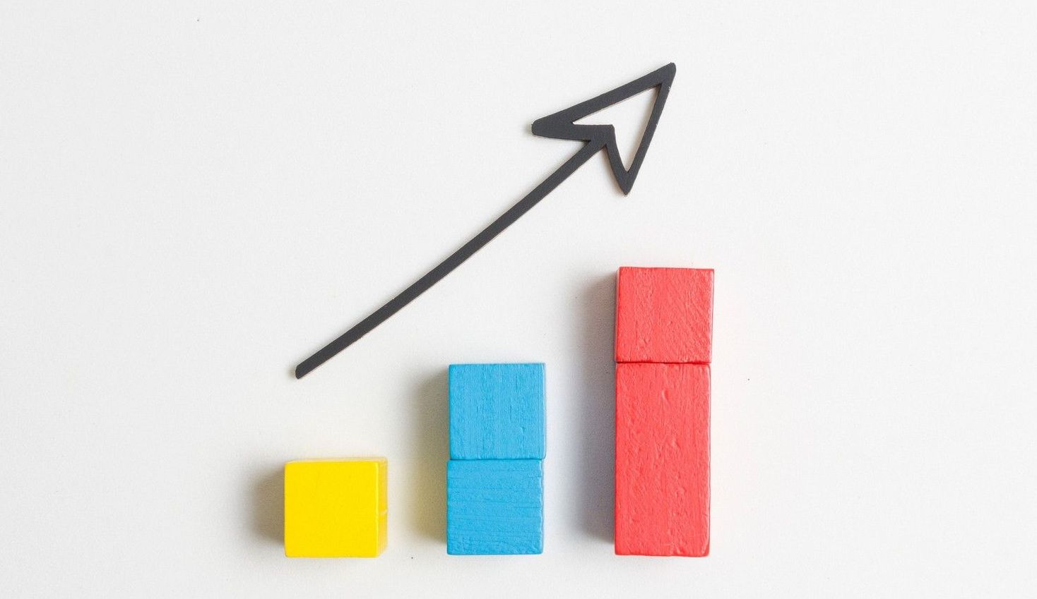 A graph made of wooden blocks with an arrow pointing up.