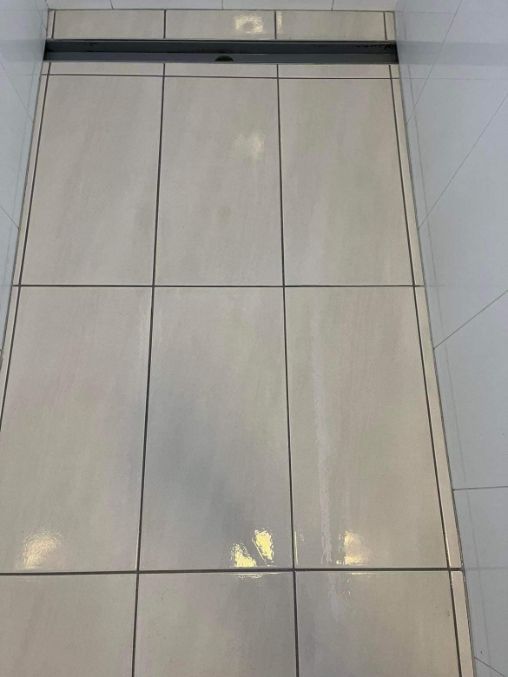 A Close Up Of A Tiled Floor In A Bathroom — Tailored Services in Mackay Harbour, QLD