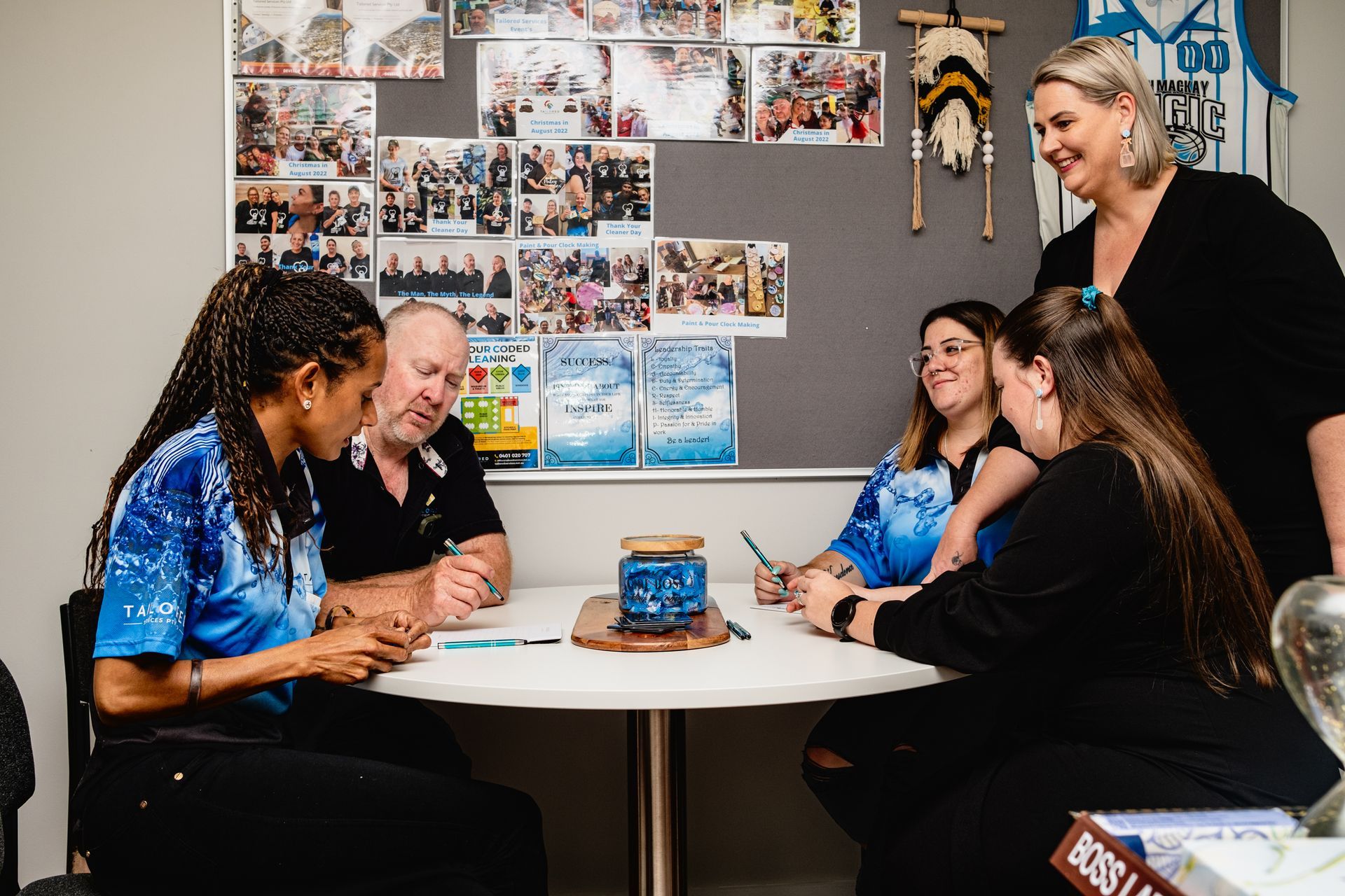 A Vacuum Cleaner is Cleaning a Carpet in a Room — Tailored Services in Walkerston, QLD