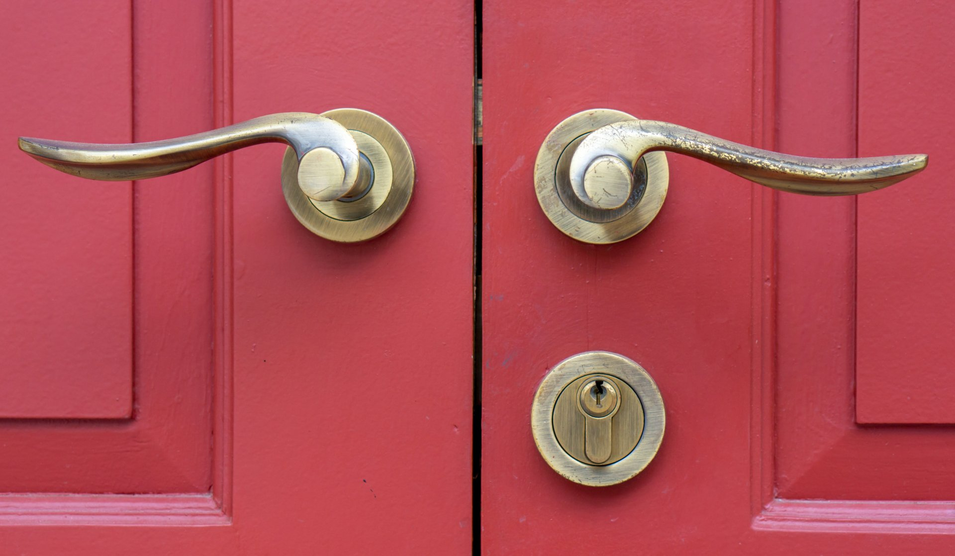 red door with golden handles