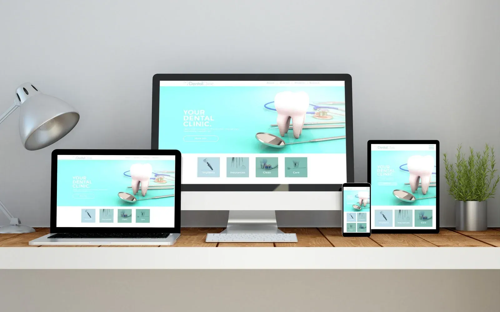 A computer , laptop , tablet and phone are sitting on a desk.