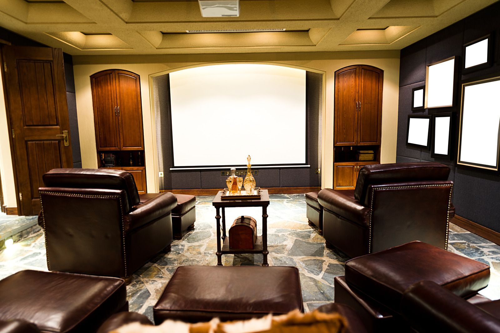 There is a projector screen in the middle of the room.
