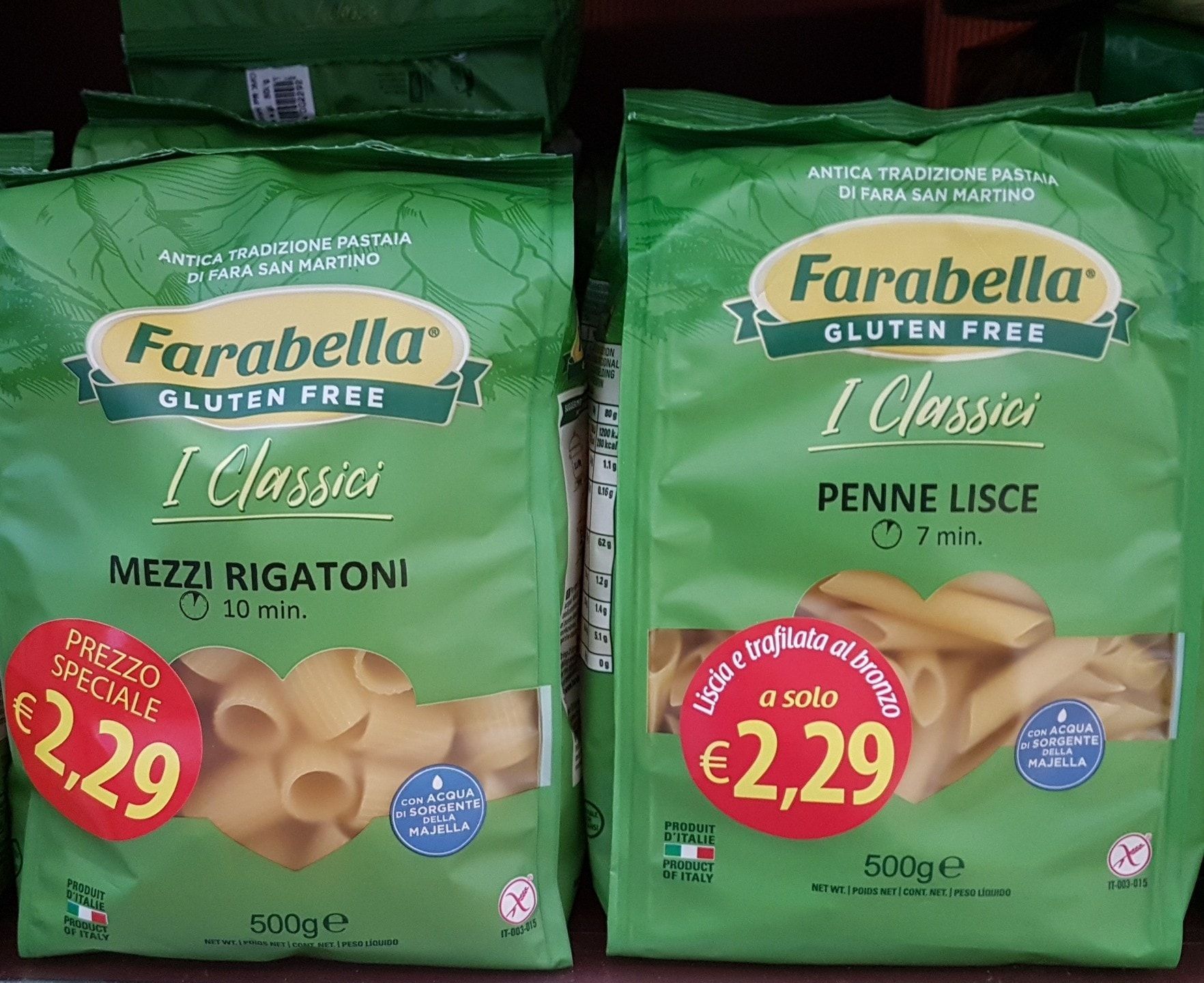 Two green bags of Farabella gluten-free pasta, 