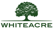 The whiteacre progress matter logo is black and green