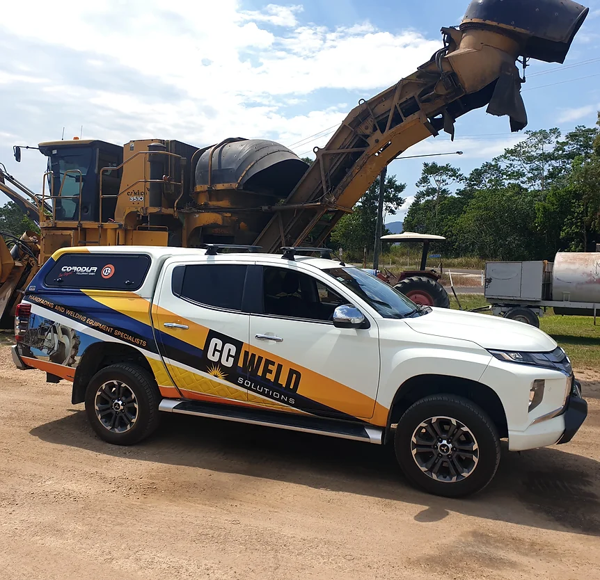 A Man Is Welding Outdoors - Welding Equipment & Services in Townsville