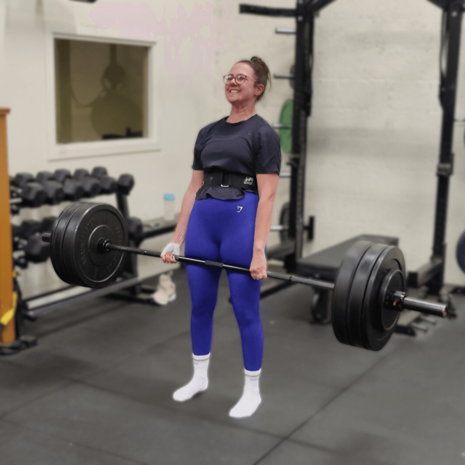 Woman happy at hitting a deadlift PB at Learn to Lift Bootcamp Glasgow