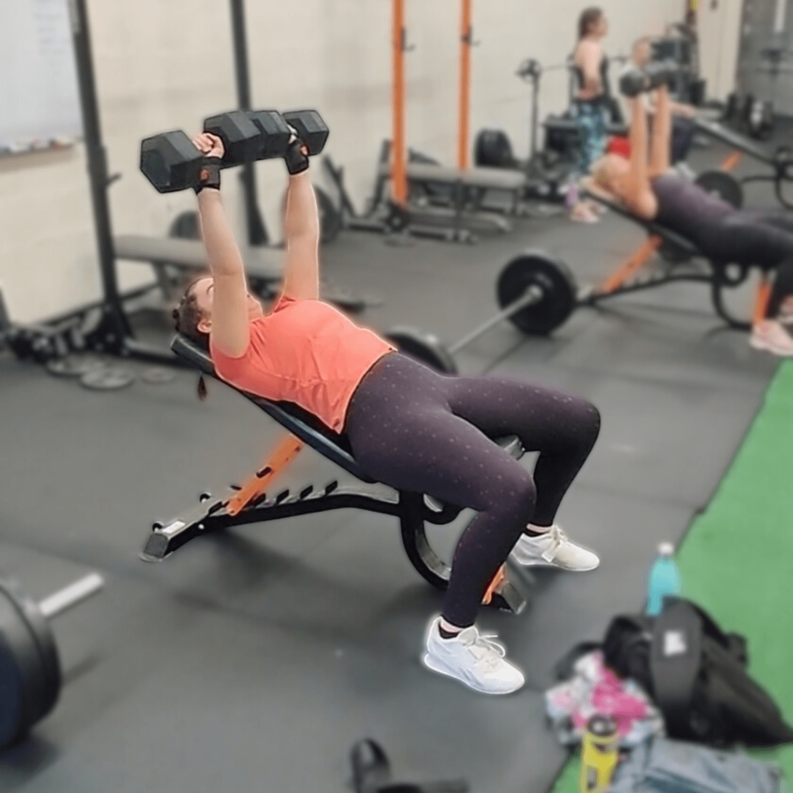 Glasgow Bootcamp session in full swing with people incline db bench pressing