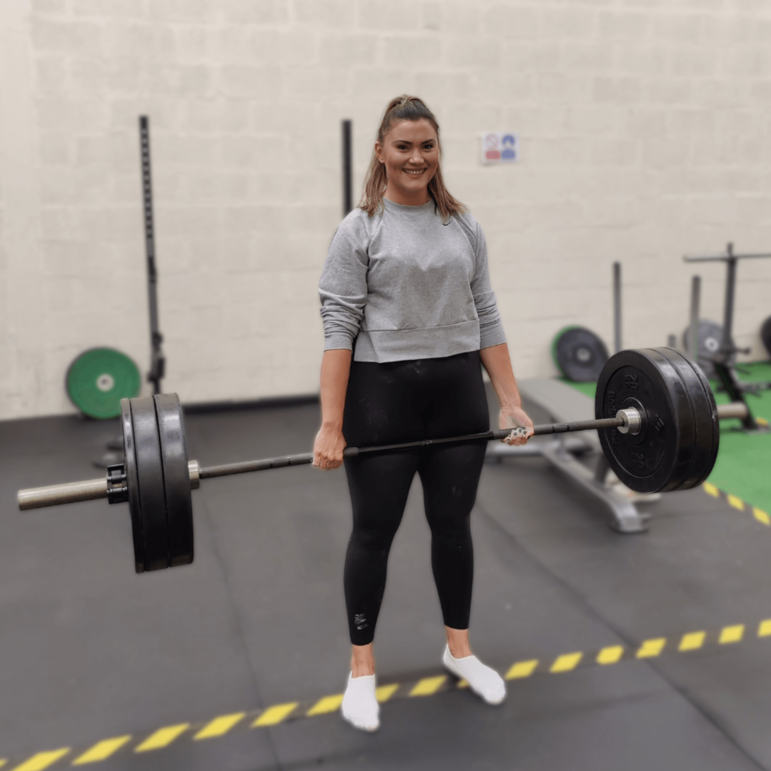 Learn to Lift Bootcamp Glasgow Woman happy about a deadlift PB