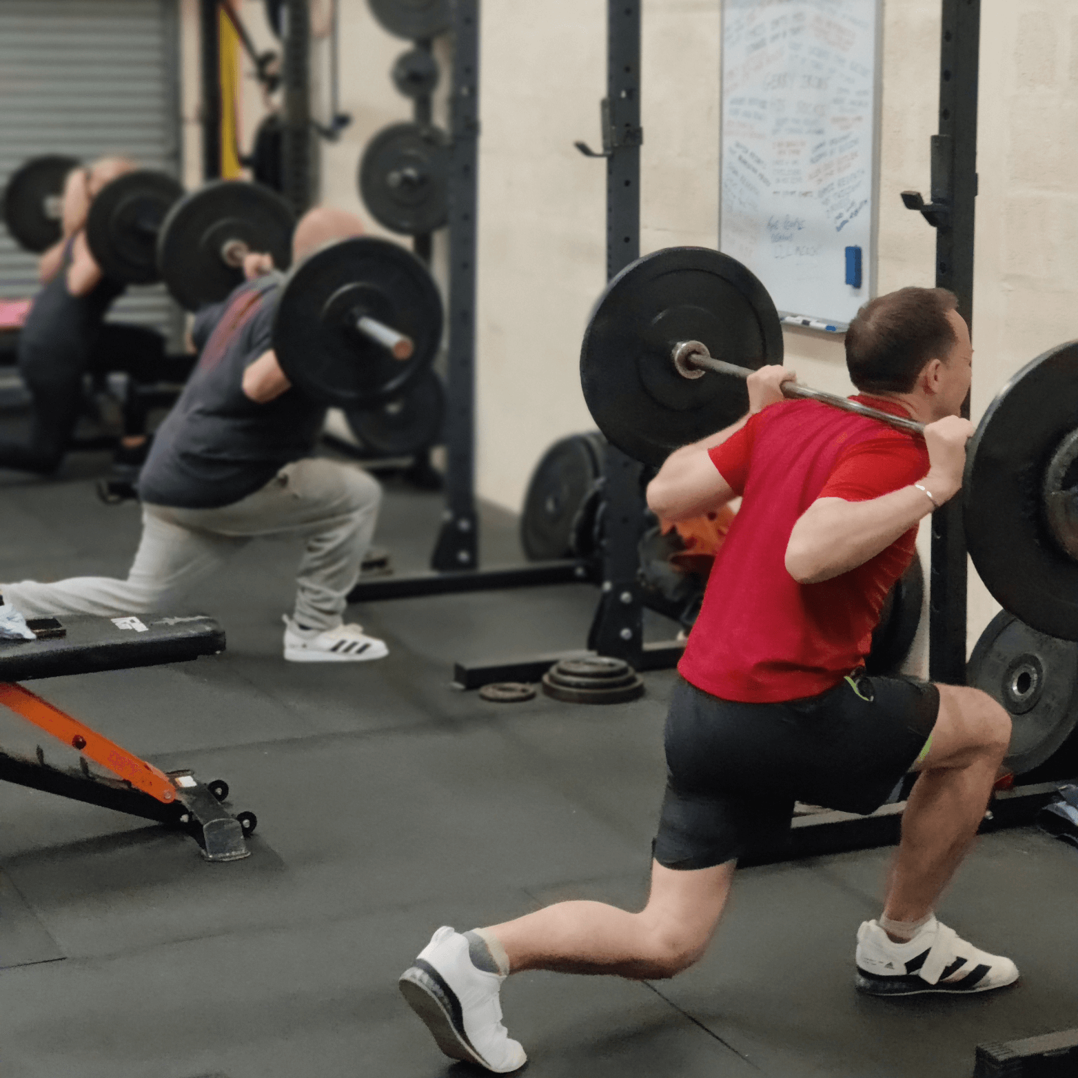 Learn to Lift Bootcamp members performing Barbell Reverse Lunges
