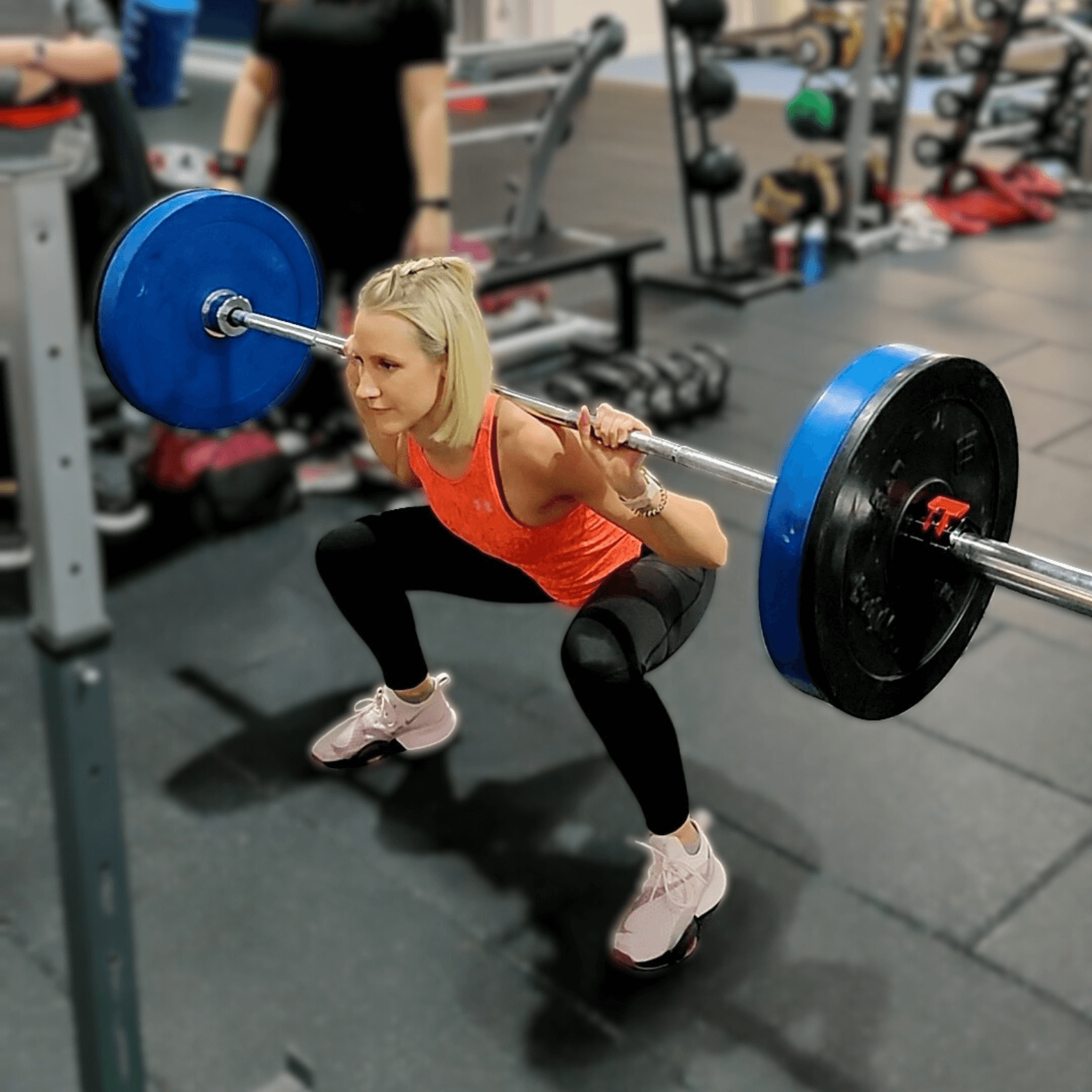Woman squatting at Learn to Lift Bootcamp Glasgow