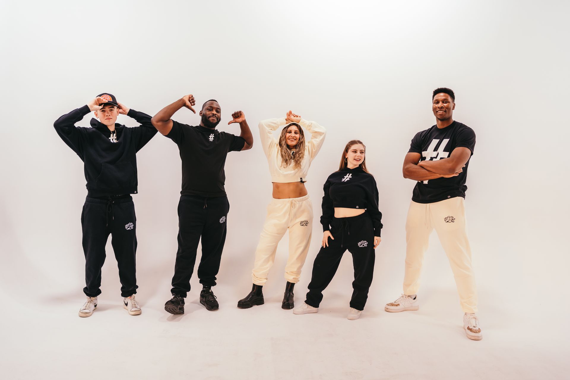 A group of people are standing next to each other on a white background.