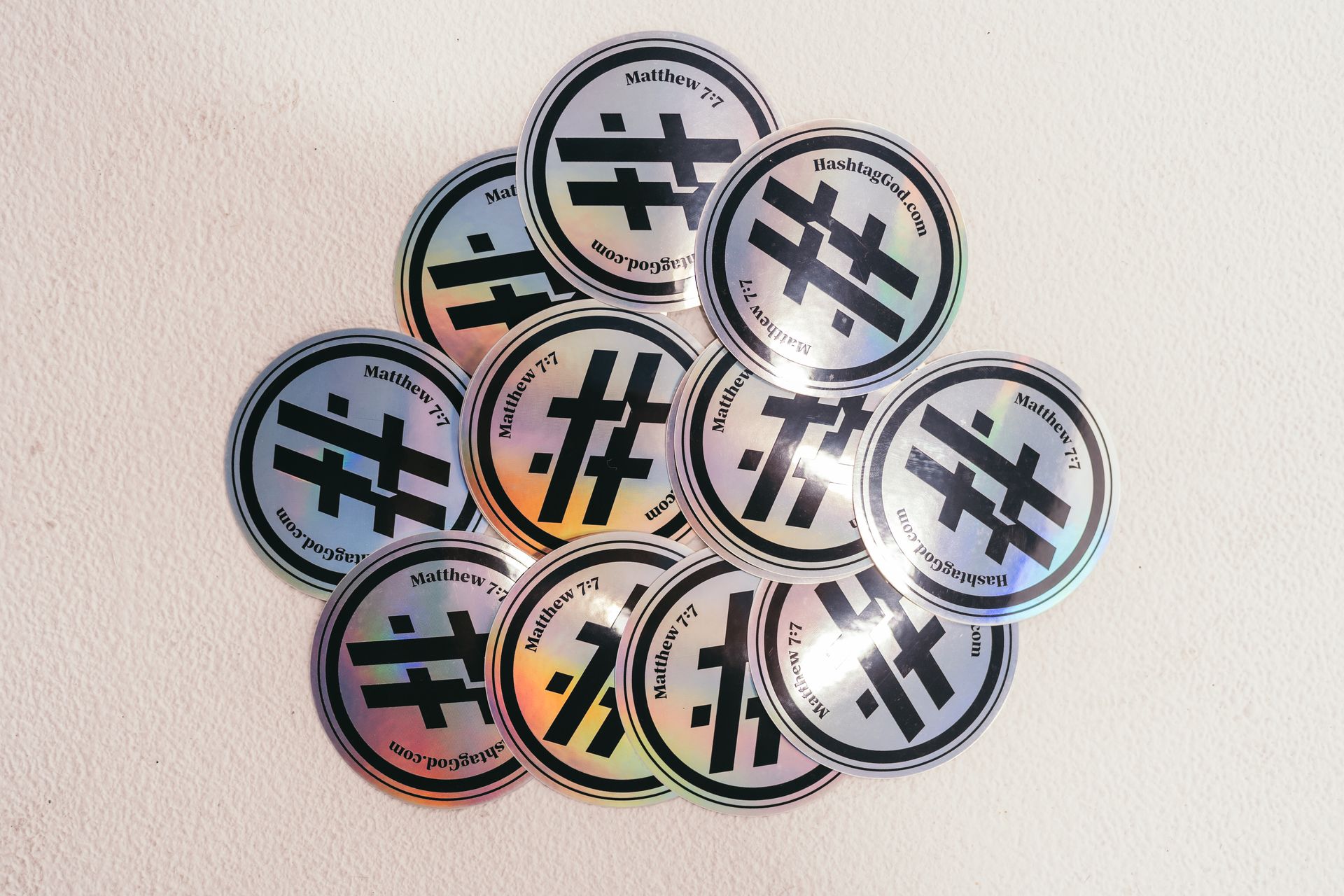 A bunch of stickers with hashtags on them