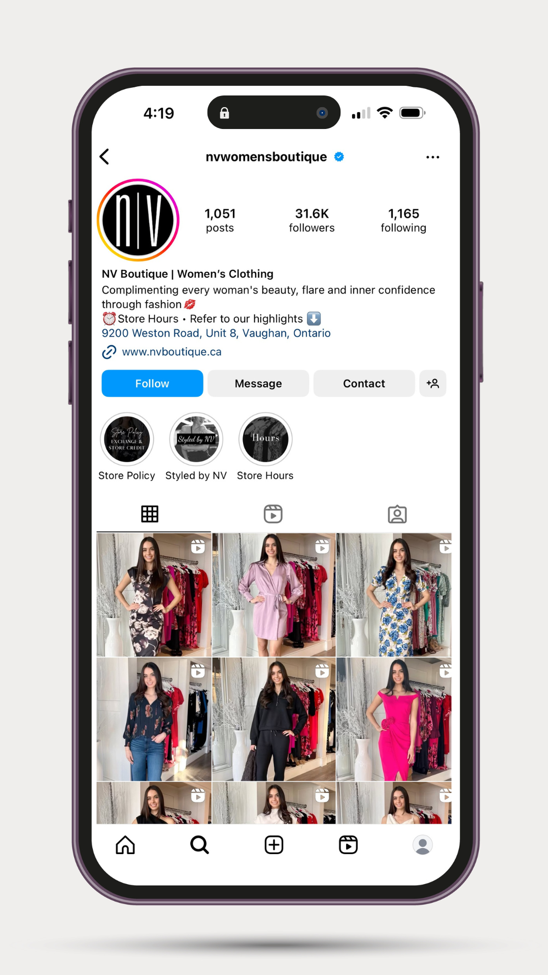 A cell phone with a picture of a woman in a dress on it.