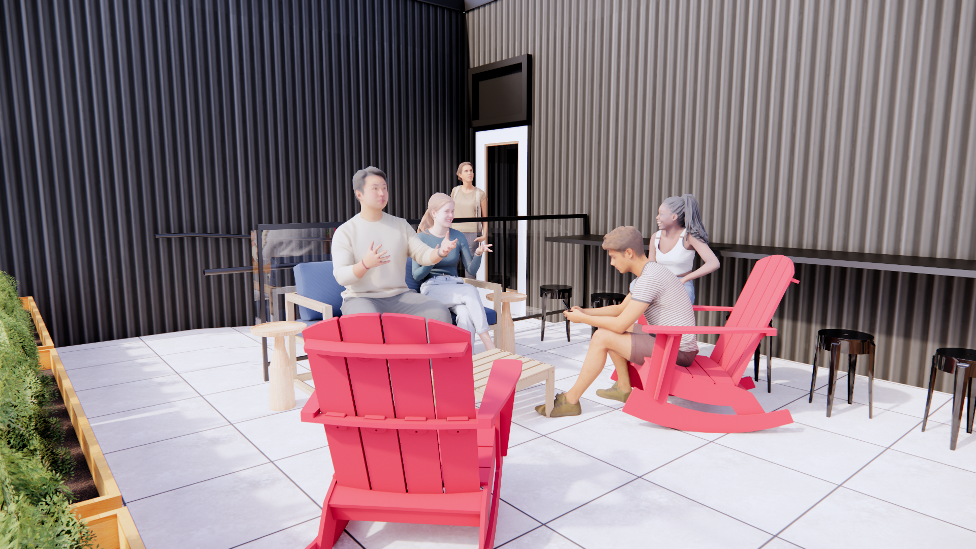 A group of people are sitting in red chairs on a patio.