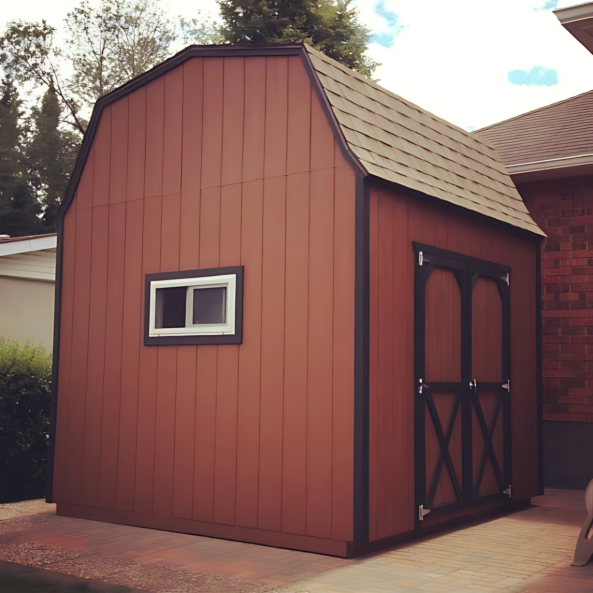 A brown barn shed with a window on the side