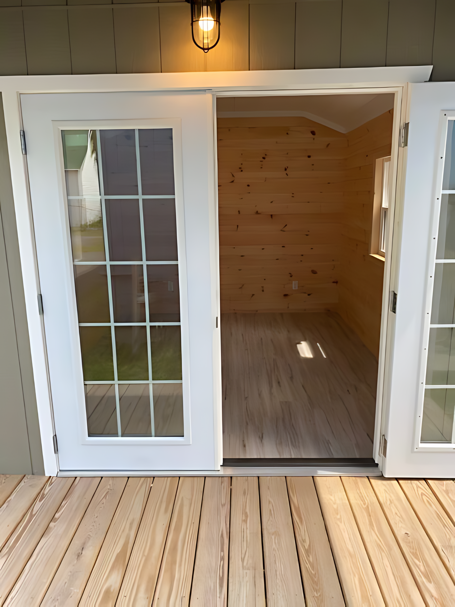 A sliding glass door opens to an empty room