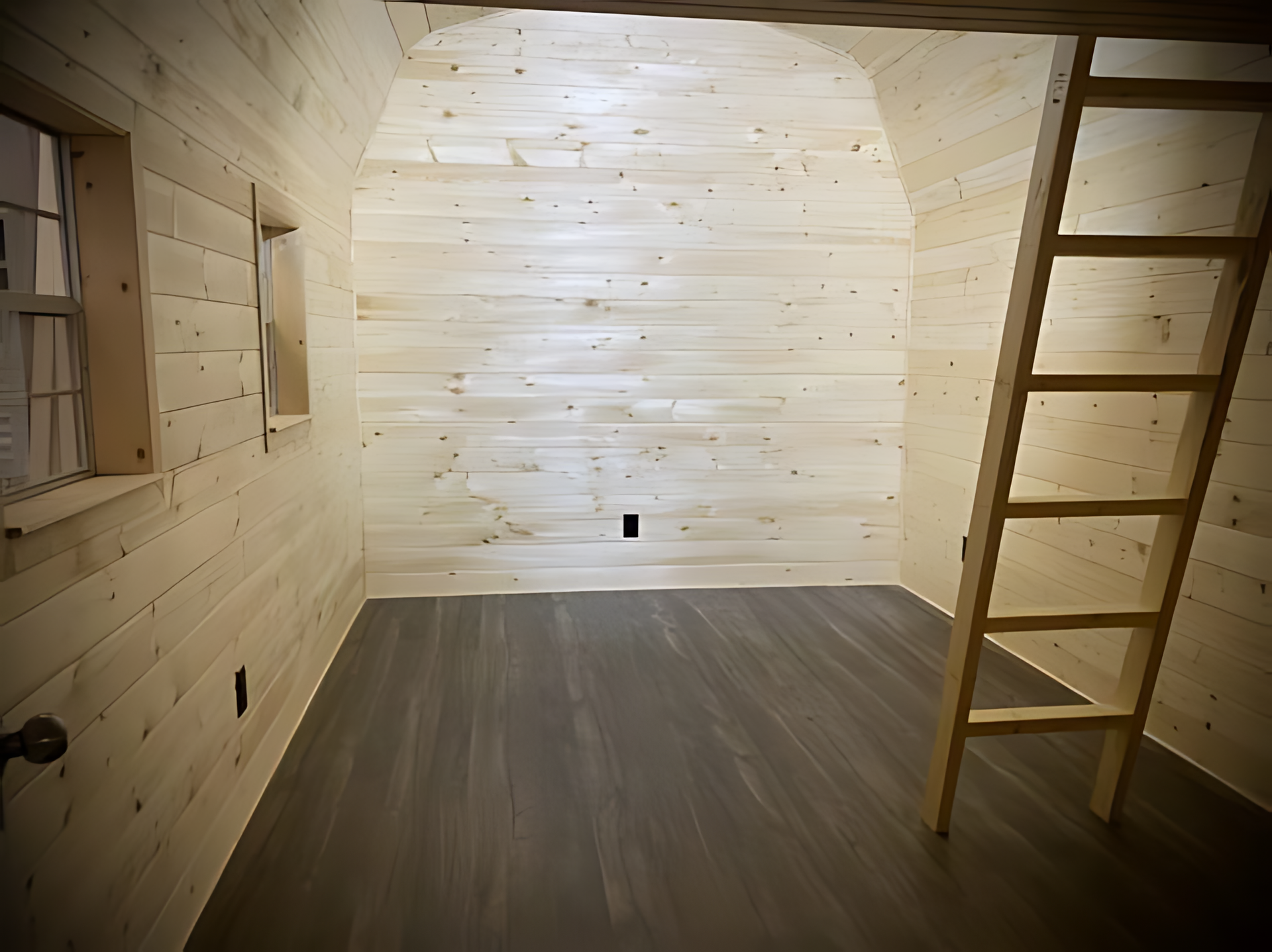 A wooden room with a ladder and a window