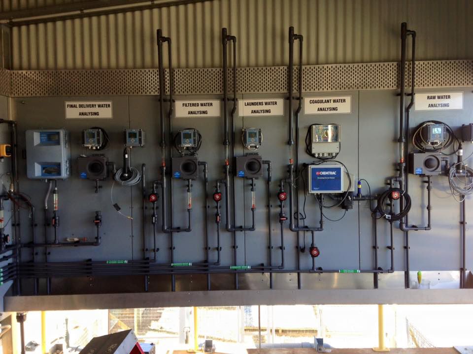 A Wall With A Lot Of Pipes And Electrical Equipment On It — CCD Electrical In Berrimah, NT