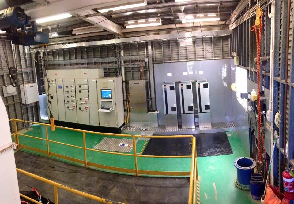 A Large Room With A Green Floor And A Yellow Railing — CCD Electrical In Berrimah, NT