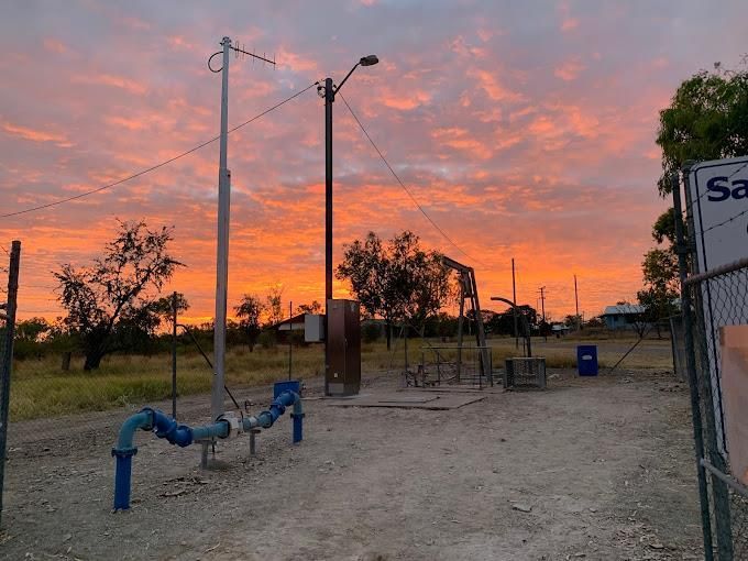 A water power plant with the sun setting in the background — CCD Electrical In Berrimah, NT