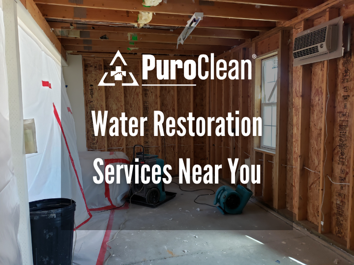 A room with a sign that says puroclean water restoration services near you