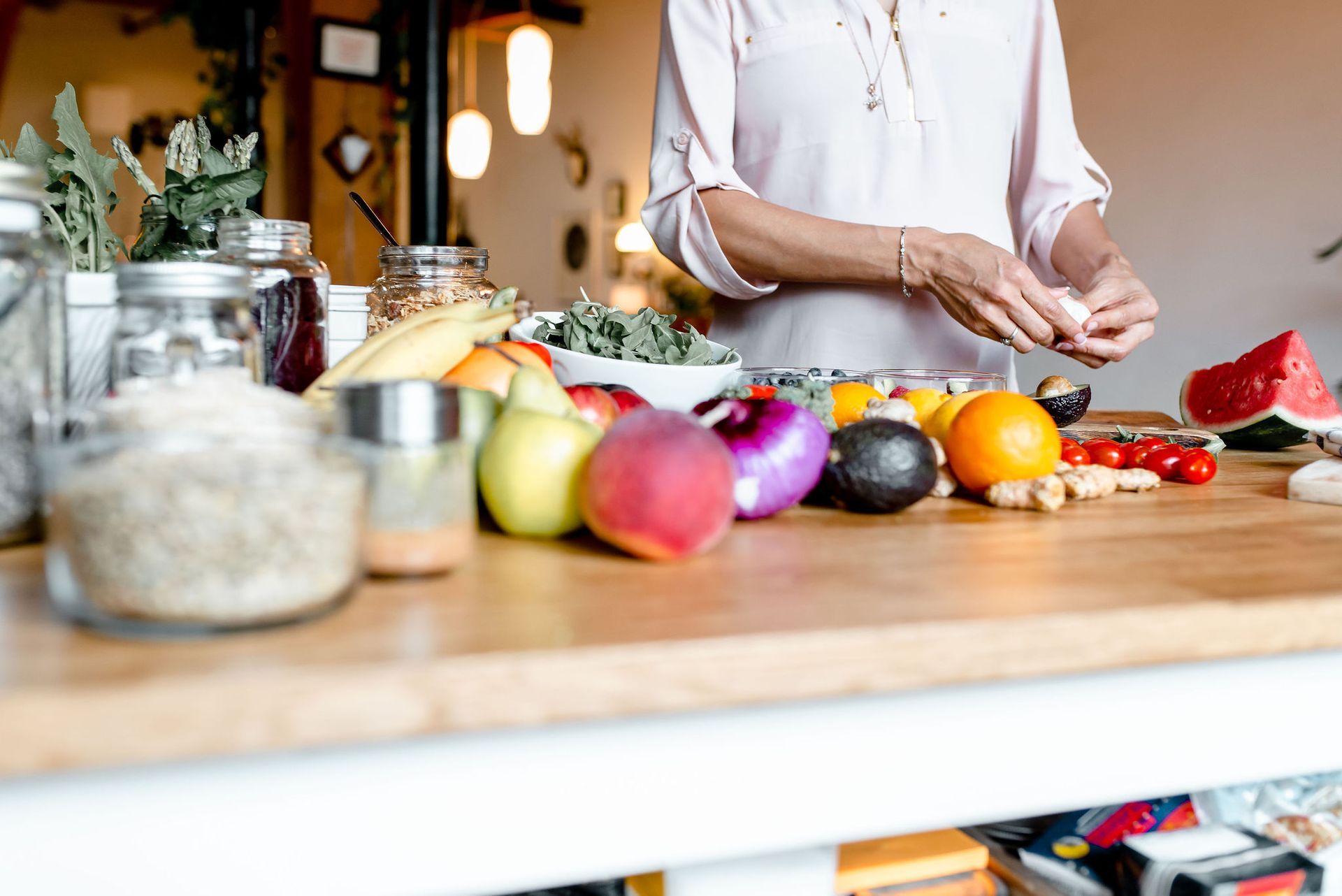 Preparing a colorful spread of fresh produce for postpartum nutrition support.