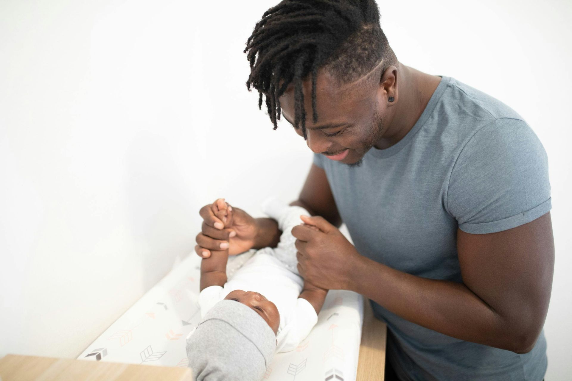 A new dad with his newborn baby
