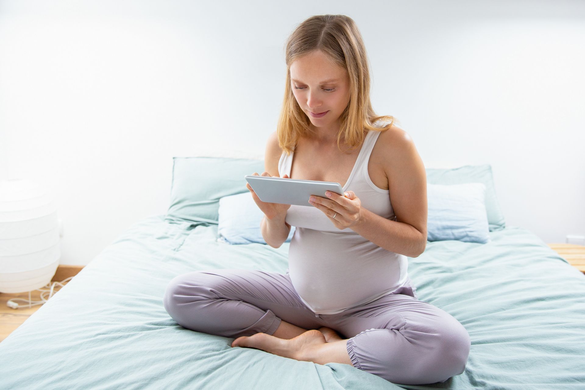 pregnant woman making a postpartum checklist