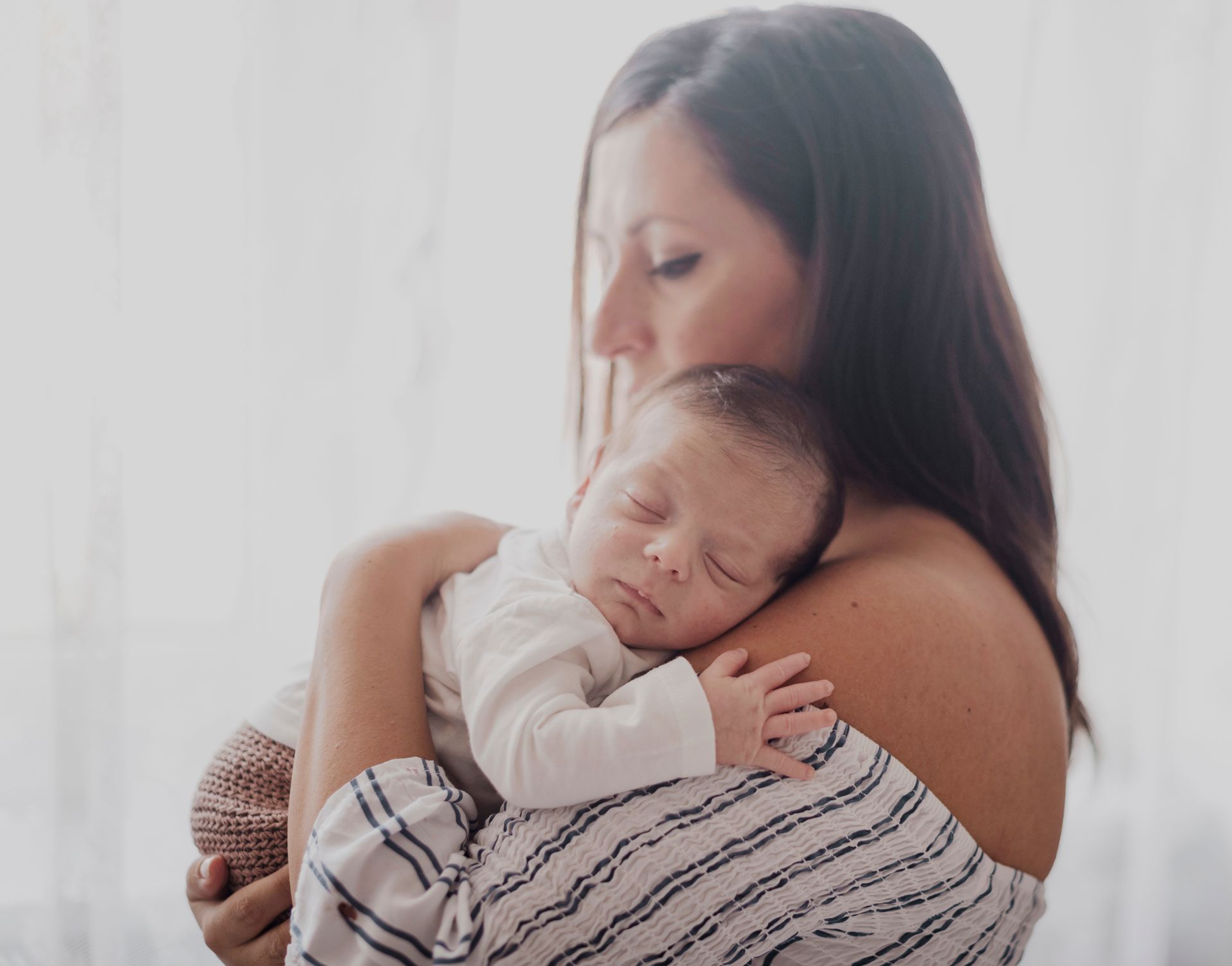 new mom holding newborn baby