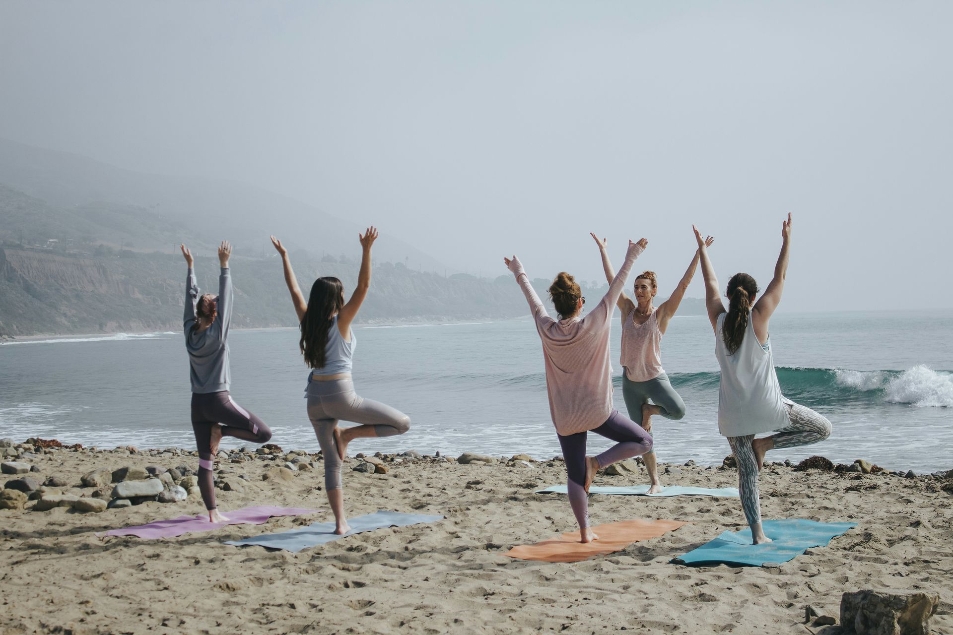 group of moms doing yoga for self-care