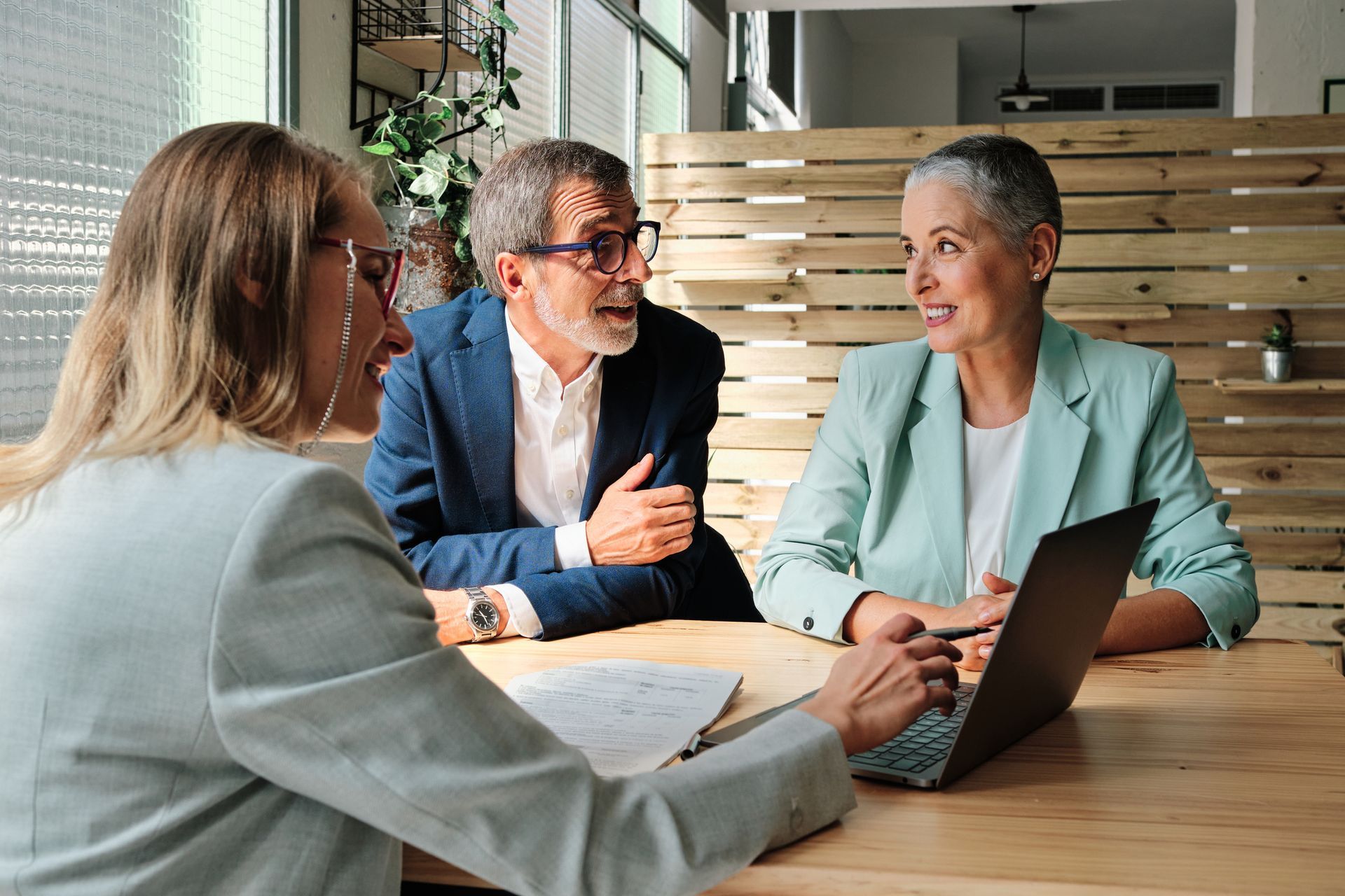 A certified public accountant discussing financial planning with clients.
