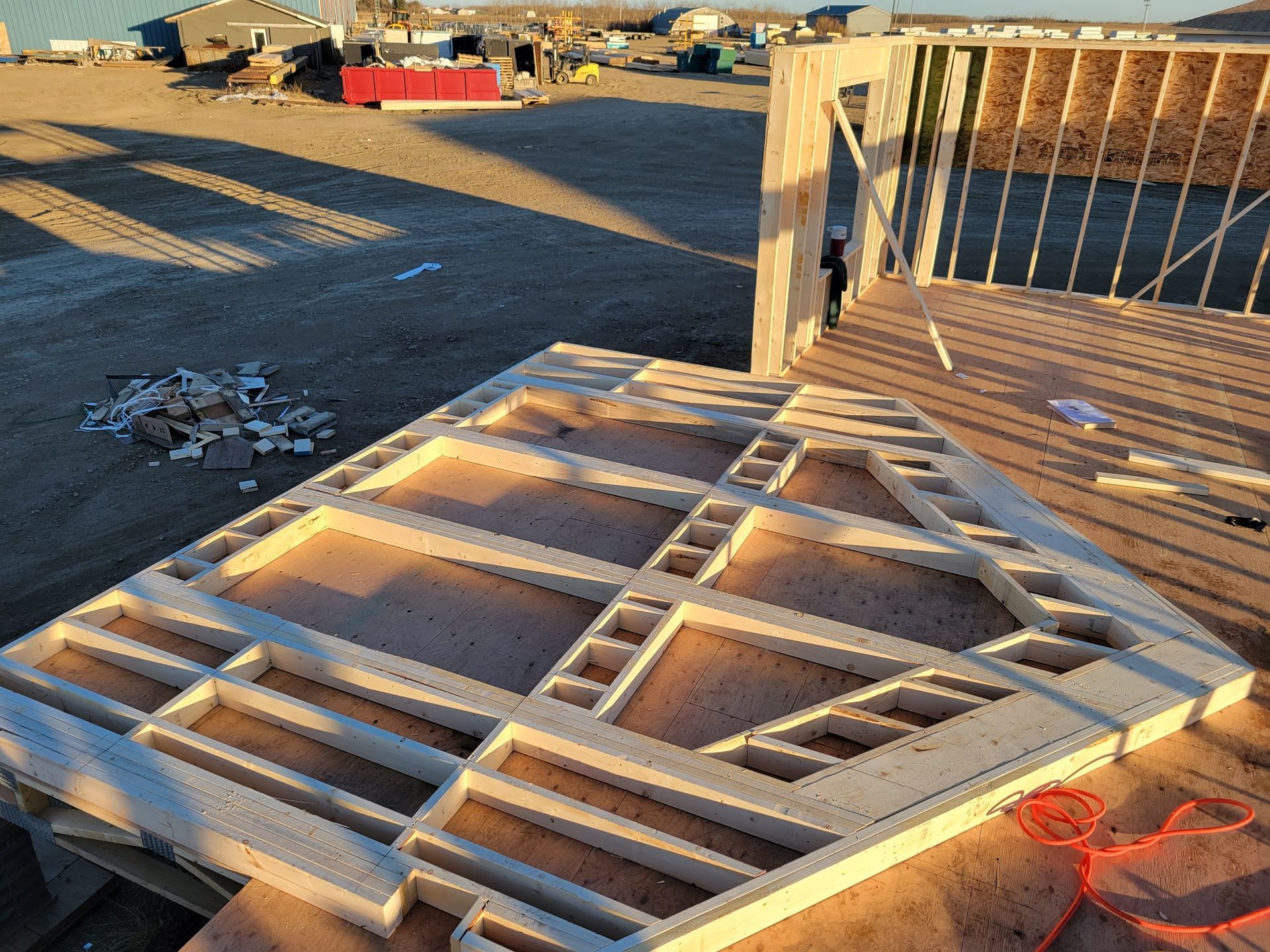A large piece of wood is sitting on top of a wooden table.