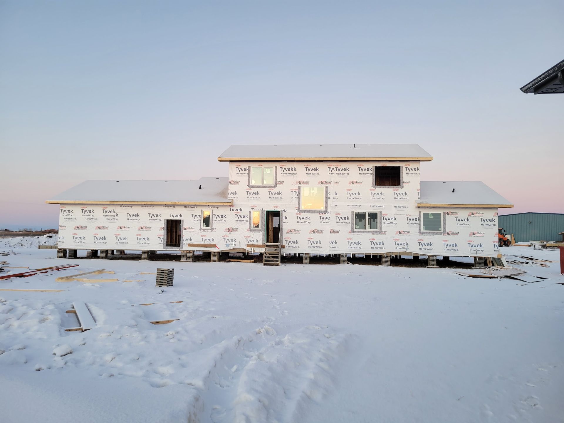 A house that is being built in the snow