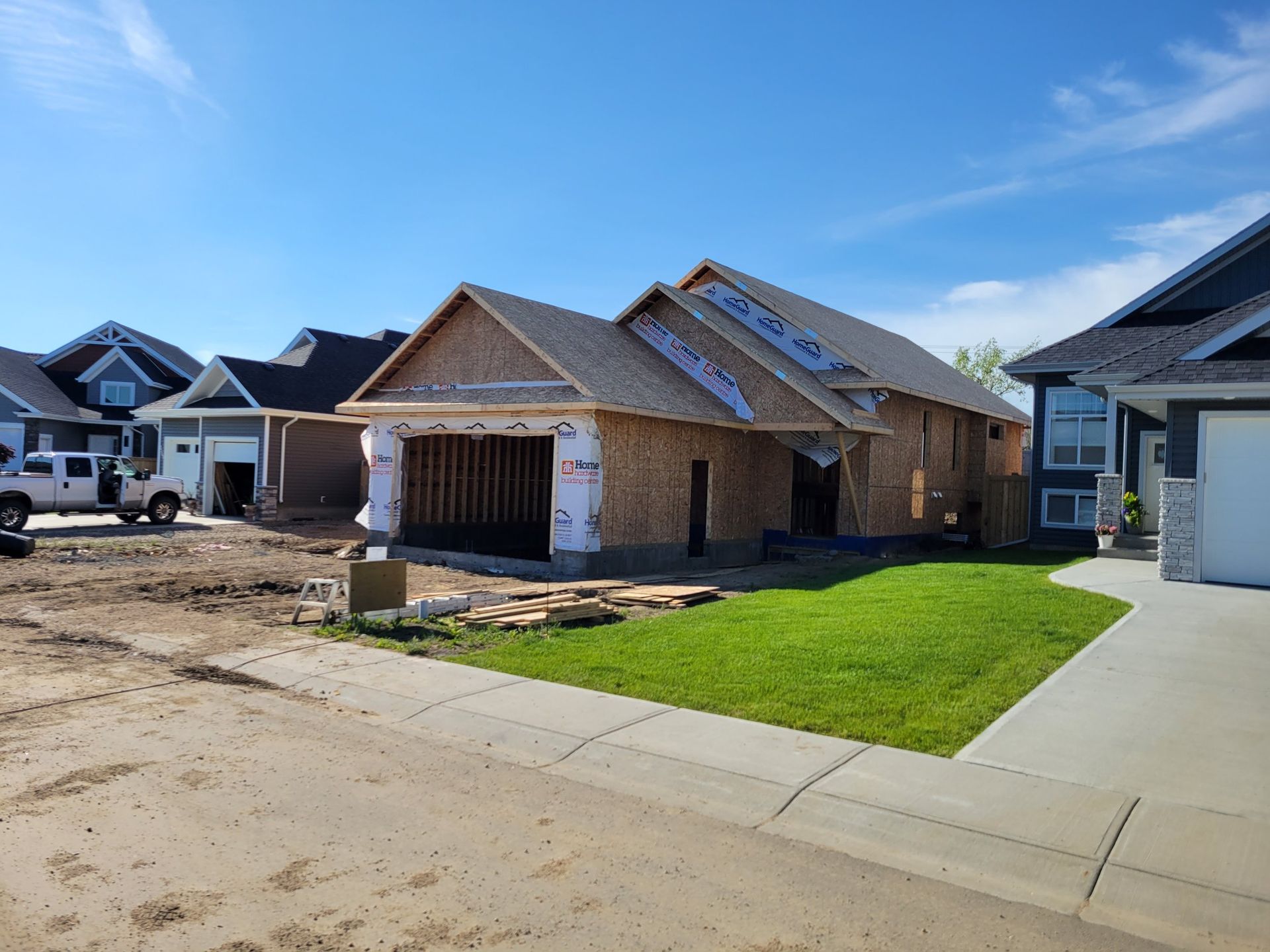 A house is being built in a residential neighborhood.