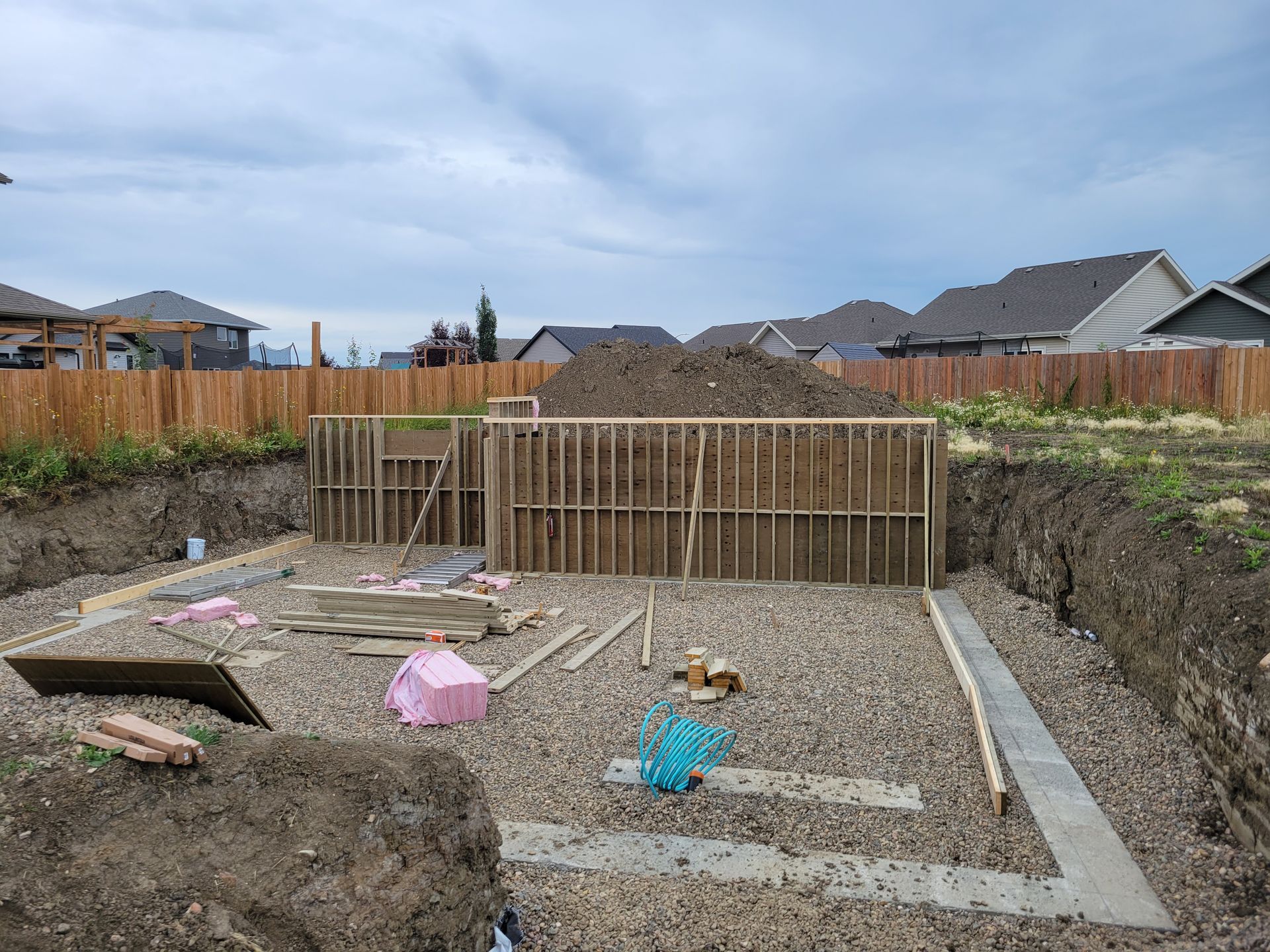 A house is being built in the backyard of a house.