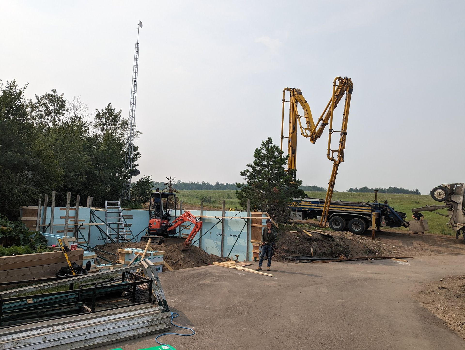 A construction site with a large m in the middle of it
