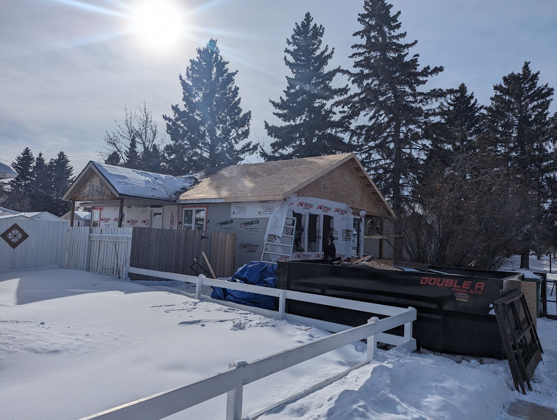 A house that is being built in the snow