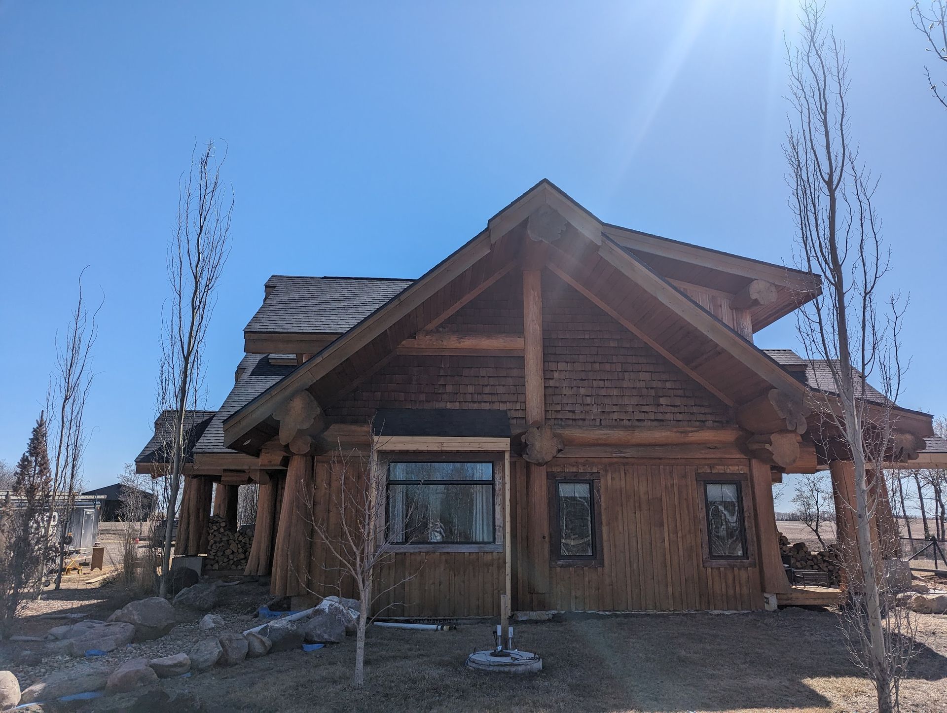A log cabin with a blue sky in the background