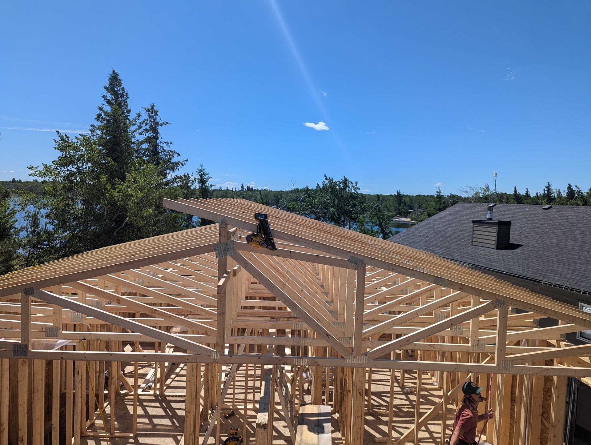 A house is being built with a lot of wooden beams.