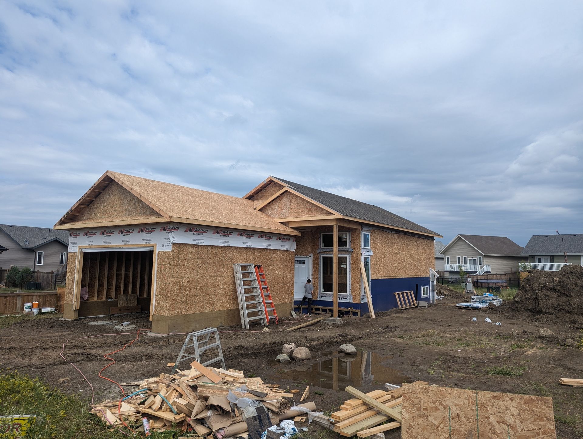A house is being built in a residential area.