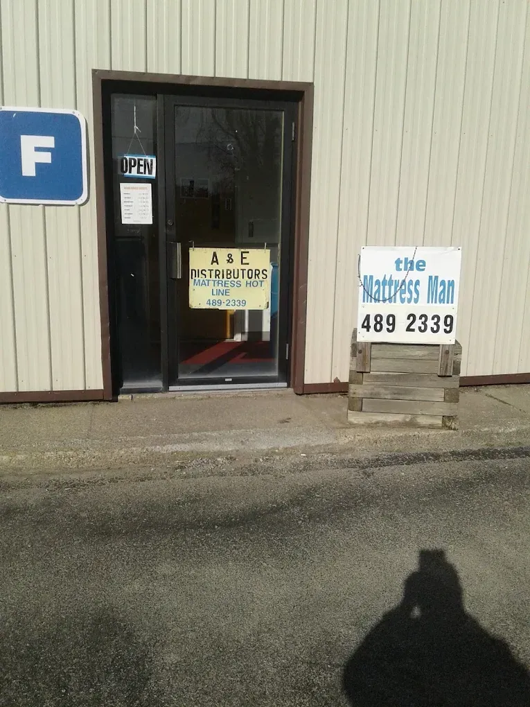 Building entrance with a glass door and sign reading 