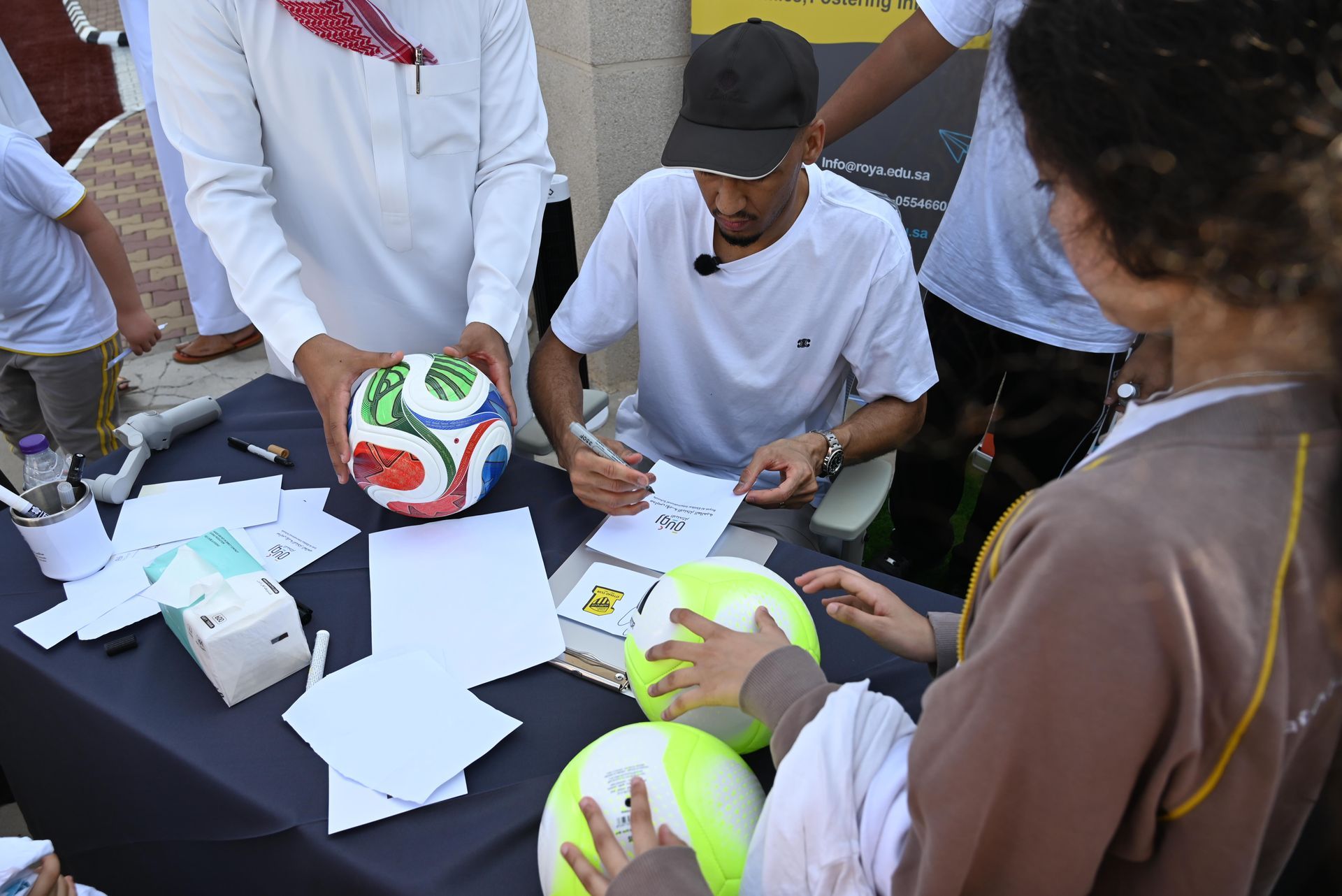 Fabinho posing for photos with students after the official opening ceremony