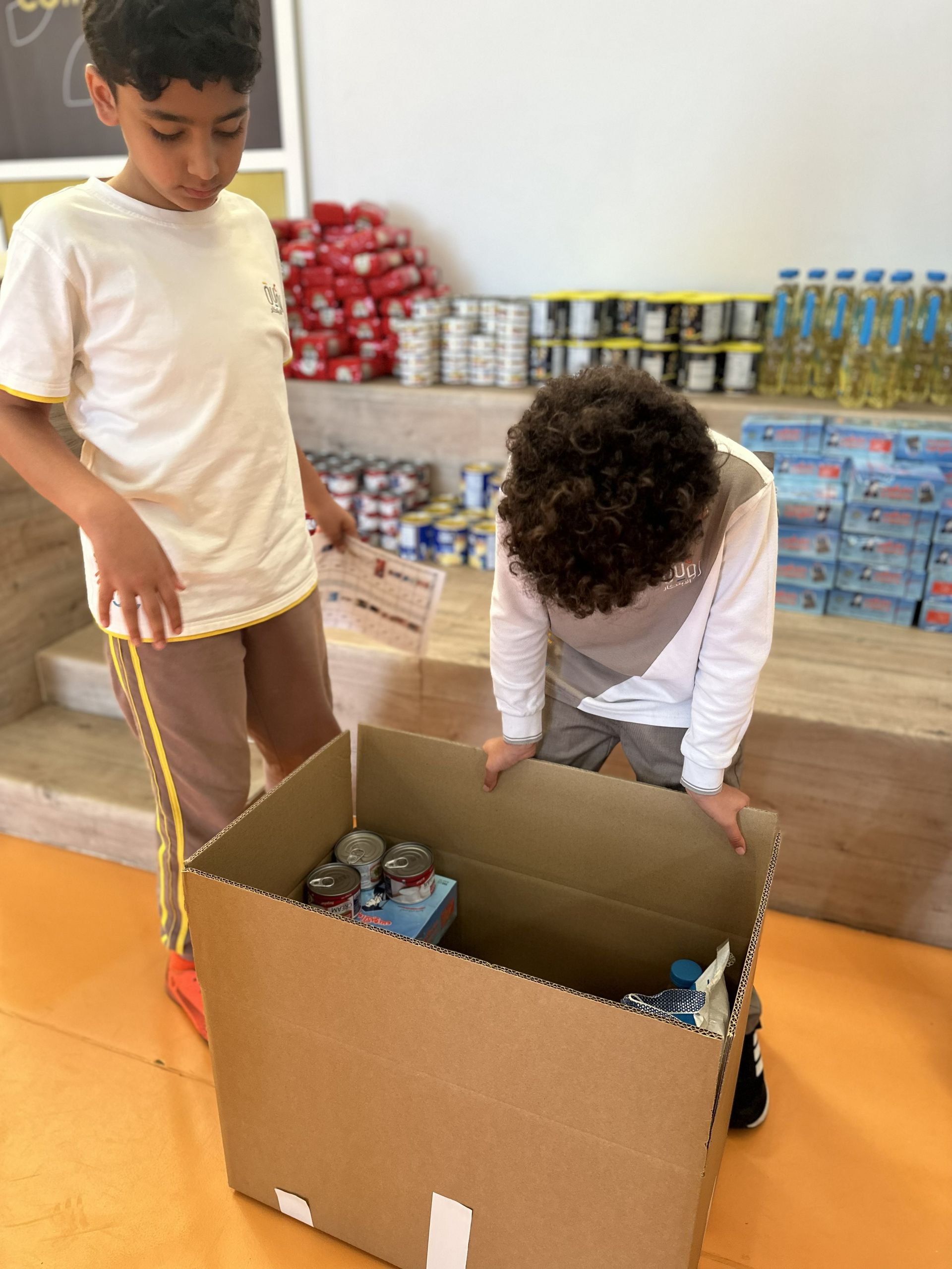 Students preparing a Ramadan donation box at Royat Al-Ebtikar International School in Jeddah.