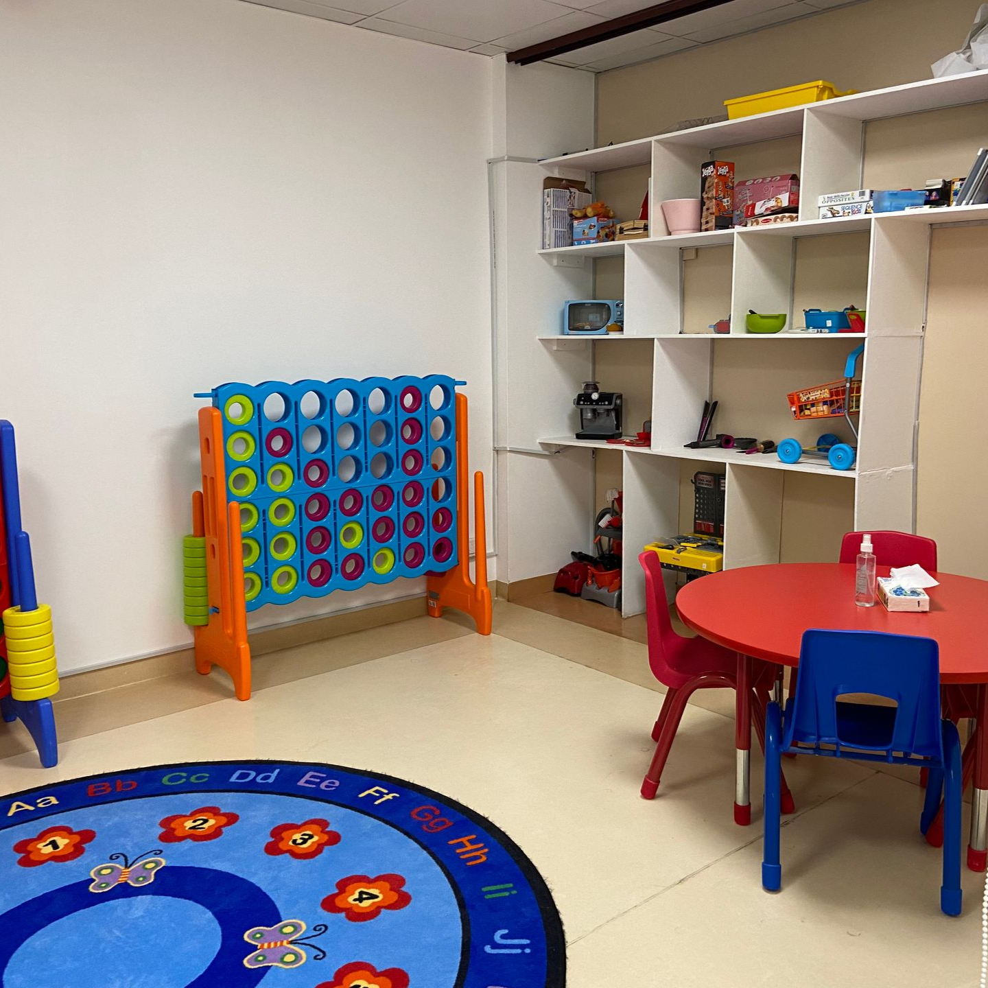 A young boy wearing a baseball cap with a yellow brim